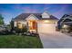 Beautiful home featuring a two-car garage and landscaped front yard at 19688 E 52Nd Ave, Denver, CO 80249