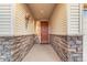 Covered entryway featuring stone details at 19688 E 52Nd Ave, Denver, CO 80249