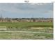 Scenic view of a golf course with deer grazing peacefully on the green at 19688 E 52Nd Ave, Denver, CO 80249