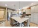 Spacious kitchen featuring a large island and stainless steel appliances at 19688 E 52Nd Ave, Denver, CO 80249