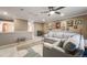 Open living room layout with comfortable seating, a ceiling fan, and stylish decor, perfect for a cozy and modern space at 19688 E 52Nd Ave, Denver, CO 80249