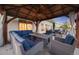 Cozy outdoor seating area with comfortable chairs, a table, and a pergola, perfect for relaxation and gatherings at 19688 E 52Nd Ave, Denver, CO 80249