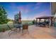 Relax on this beautiful stamped concrete patio, complete with an umbrella and outdoor seating and views of the golf course at 19688 E 52Nd Ave, Denver, CO 80249