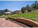 Large backyard with a greenhouse and chicken coop, perfect for hobby farming and gardening at 2571 Sw Grapevine Rd, Idledale, CO 80453