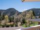 Picturesque backyard view featuring lush greenery and stunning mountain scenery at 2571 Sw Grapevine Rd, Idledale, CO 80453