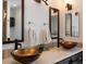 Bathroom with double vanities and bronze vessel sinks at 2571 Sw Grapevine Rd, Idledale, CO 80453