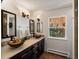 Bathroom with double vanities and bronze vessel sinks at 2571 Sw Grapevine Rd, Idledale, CO 80453