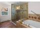 Elegant bathroom with glass-enclosed shower and separate soaking tub at 2571 Sw Grapevine Rd, Idledale, CO 80453