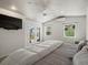 Serene bedroom with french doors, natural light, and vaulted ceilings at 2571 Sw Grapevine Rd, Idledale, CO 80453