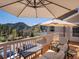 Relax on this beautiful deck with an umbrella while overlooking serene mountain views at 2571 Sw Grapevine Rd, Idledale, CO 80453