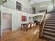 Light-filled dining room with hardwood floors, and adjacent staircase with iron railings at 2571 Sw Grapevine Rd, Idledale, CO 80453
