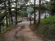Secluded home featuring long private driveway with trees providing privacy and seclusion at 2571 Sw Grapevine Rd, Idledale, CO 80453
