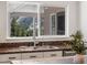 Kitchen sink with stunning views of the natural landscape visible through the window at 2571 Sw Grapevine Rd, Idledale, CO 80453
