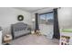 Bedroom features a crib, rocking horse, window, and decor at 5251 Central Park Blvd, Denver, CO 80238