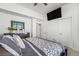 Spacious bedroom with a ceiling fan, dresser, decor, and two closets at 5251 Central Park Blvd, Denver, CO 80238