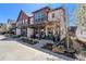 Attractive townhome boasting a covered front porch and well-maintained landscaping at 5251 Central Park Blvd, Denver, CO 80238