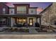 Charming two-story townhome featuring a cozy front porch with seating, great for relaxing outdoors at 5251 Central Park Blvd, Denver, CO 80238