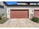 Exterior view of the home's attached two car garage at 5251 Central Park Blvd, Denver, CO 80238
