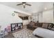 Open-concept living room featuring a comfortable sofa, stylish decor, and seamless flow to the kitchen at 5251 Central Park Blvd, Denver, CO 80238