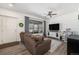Bright living room showcasing a comfortable sofa, modern TV console, and stylish decor at 5251 Central Park Blvd, Denver, CO 80238