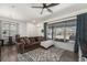 Bright living room offering a comfortable sofa, decorative rug, and a view to the neighborhood at 5251 Central Park Blvd, Denver, CO 80238