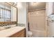 Well-lit bathroom with a shower and tub combo and decorative tile accents around the vanity at 441 Johnson St, Frederick, CO 80530