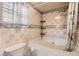 Bathroom featuring a shower-tub and tiled walls at 441 Johnson St, Frederick, CO 80530