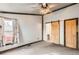 Bright bedroom with barn door and carpet flooring at 441 Johnson St, Frederick, CO 80530