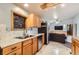 Kitchen with stainless steel appliances and granite countertops and view into living area at 441 Johnson St, Frederick, CO 80530