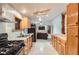 Well-lit kitchen with a gas stove, stainless steel appliances, and bright countertops at 441 Johnson St, Frederick, CO 80530