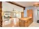 Open living area with hardwood floors, unique architectural details, and a seamless flow to the kitchen at 441 Johnson St, Frederick, CO 80530