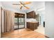 A kitchen with a sliding glass door to a sunroom at 9590 Lowell Blvd, Westminster, CO 80031