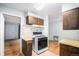 A kitchen with white appliances and wood cabinets at 9590 Lowell Blvd, Westminster, CO 80031