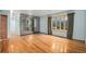 A well lit living room with hardwood floors and a bay window at 9590 Lowell Blvd, Westminster, CO 80031