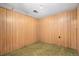 Small room with outdated wood paneling and flooring ideal for storage or utility needs at 9590 Lowell Blvd, Westminster, CO 80031