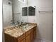Bathroom with glass bowl sink, granite countertop and vanity with ample storage at 12304 W Cross Dr # 304, Littleton, CO 80127