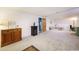 Finished basement with a neutral carpet and plenty of room for storage at 6147 Jellison Way, Arvada, CO 80004