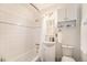Well-maintained bathroom features a tub/shower, white vanity, and ample storage space at 6147 Jellison Way, Arvada, CO 80004