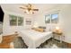 Bright bedroom with hardwood floors and large windows at 6147 Jellison Way, Arvada, CO 80004