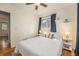 Bedroom featuring hardwood floors, natural lighting and ceiling fan at 6147 Jellison Way, Arvada, CO 80004