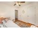 Bright bedroom with hardwood floors, closet and ensuite bathroom at 6147 Jellison Way, Arvada, CO 80004