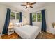 Bedroom featuring hardwood floors, natural lighting and ceiling fan at 6147 Jellison Way, Arvada, CO 80004