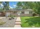 Charming single-story home with a well-manicured lawn and inviting curb appeal at 6147 Jellison Way, Arvada, CO 80004