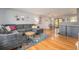 Bright living room with hardwood floors, stylish furniture, and natural light at 6147 Jellison Way, Arvada, CO 80004