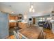 Open concept kitchen and living area offering seamless flow and abundant natural light at 6147 Jellison Way, Arvada, CO 80004