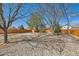 Wide backyard with landscaping with an outdoor patio and wooden fence at 125 S Fulton Ave, Fort Lupton, CO 80621