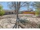Wide backyard with landscaping with an outdoor patio and wooden fence at 125 S Fulton Ave, Fort Lupton, CO 80621