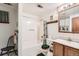 Bright bathroom with a tub and shower combination and classic vanity at 125 S Fulton Ave, Fort Lupton, CO 80621
