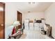 Simple bedroom featuring boxes for storage, a lamp, and a fan at 125 S Fulton Ave, Fort Lupton, CO 80621
