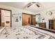 Bedroom featuring a queen-sized bed, closet, and access to an ensuite bathroom with shower at 125 S Fulton Ave, Fort Lupton, CO 80621